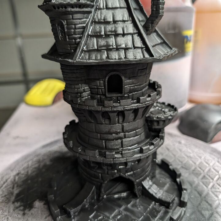 Detailed black wizard tower with a conical roof and stone texture